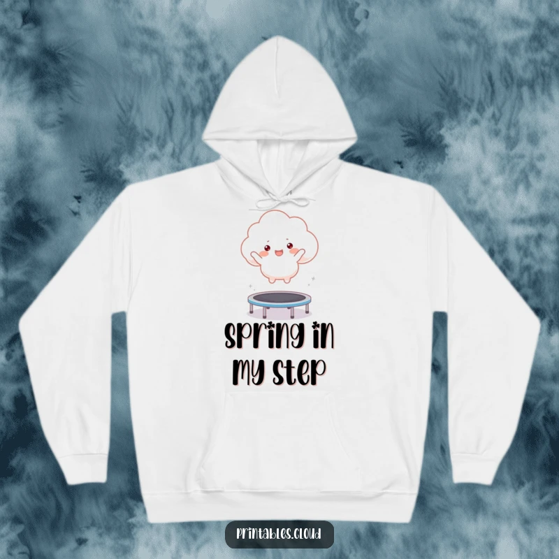 Funny hoodie featuring a happy cloud character energetically bouncing on a trampoline, combining comfort with fun.